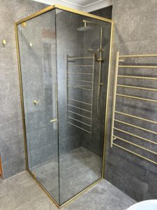 semi frameless with gold fittings and frame